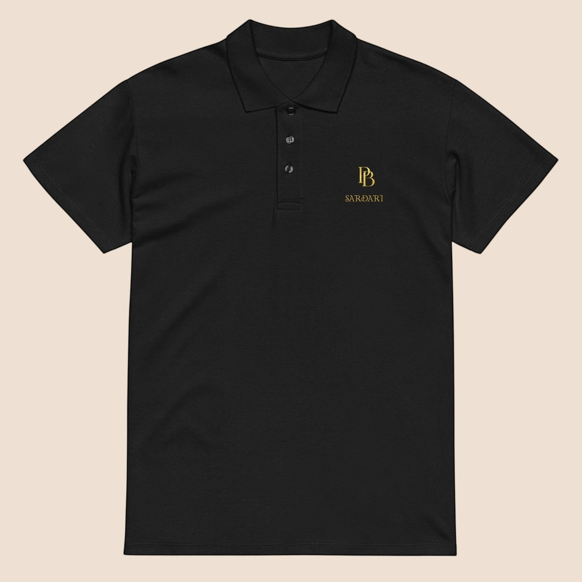 PUNJAB BOLDA SARDARI black pique cotton polo shirt with gold embroidered logo and three-button placket.