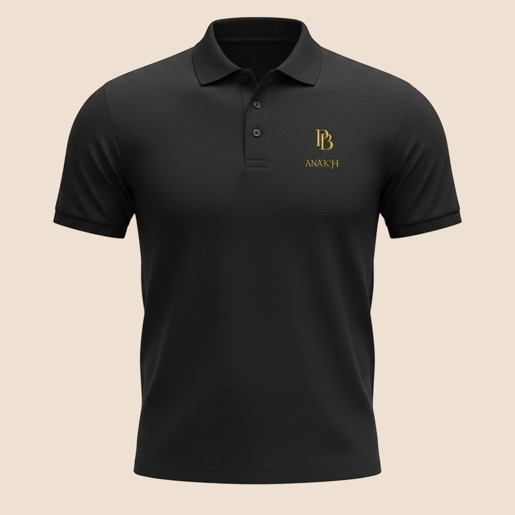 PUNJAB BOLDA ANAKH premium black pique cotton polo shirt with gold logo embroidery and 3-button placket.