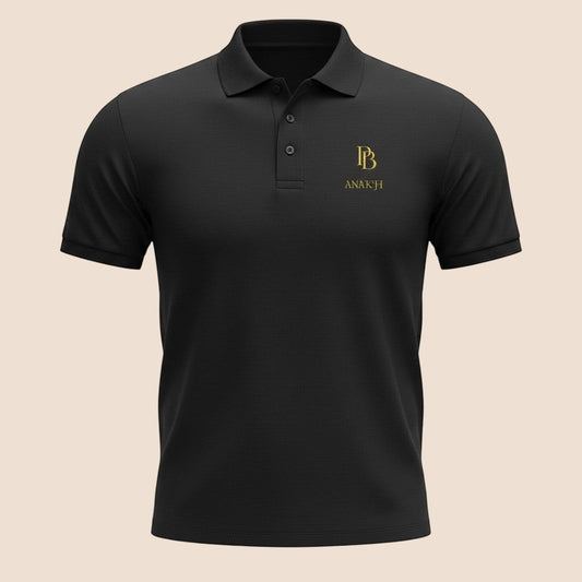 PUNJAB BOLDA ANAKH premium black pique cotton polo shirt with gold logo embroidery and 3-button placket.