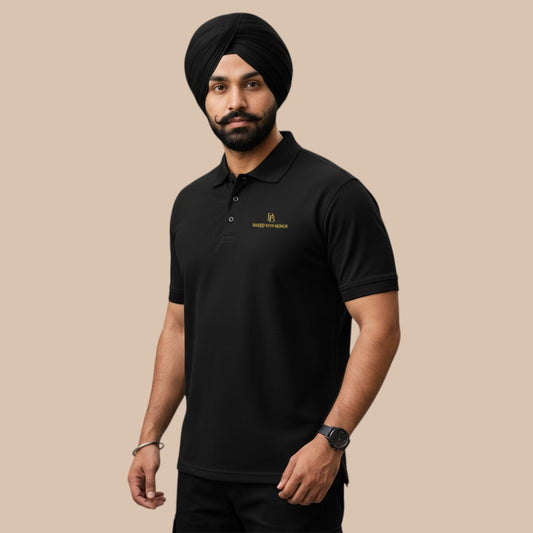 PUNJAB BOLDA black 100% cotton pique polo shirt with gold embroidered logo on chest. Classic fit with ribbed collar and button placket.