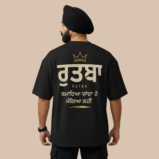 PUNJAB BOLDA black oversized t-shirt with dropped shoulders and wide collar, featuring gold Punjabi text and crown graphic.
