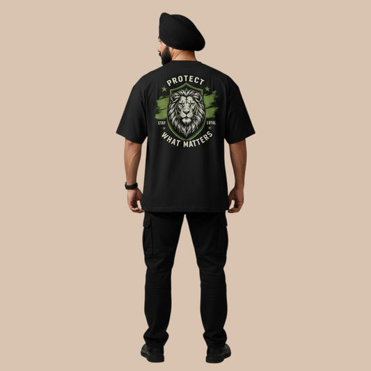 PUNJAB BOLDA black oversized t-shirt with a lion graphic and the text "PROTECT WHAT MATTERS" on the back. Made from 100% organic cotton.