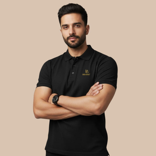 PUNJAB BOLDA black pique polo shirt with gold embroidered logo on chest, short sleeves, ribbed collar, and button placket.