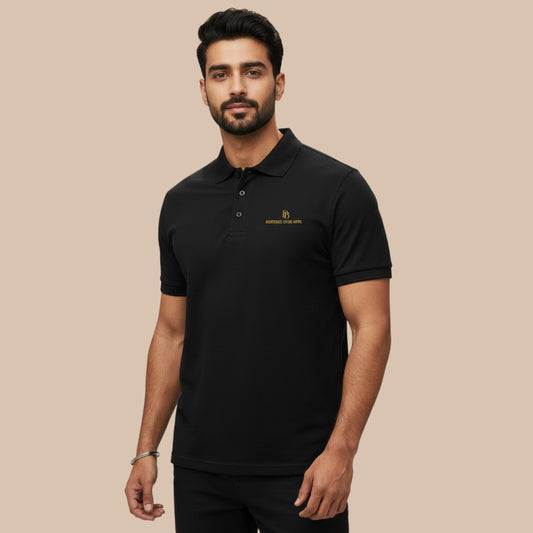 PUNJAB BOLDA black pique polo shirt with embroidered logo, ribbed collar, and button placket. Made from 100% cotton.