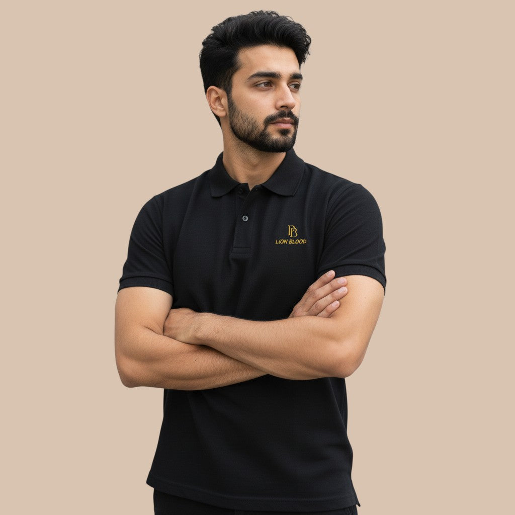 PUNJAB BOLDA black pique polo shirt with gold LION BLOOD logo, 100% cotton, classic fit, ribbed collar, and button placket.