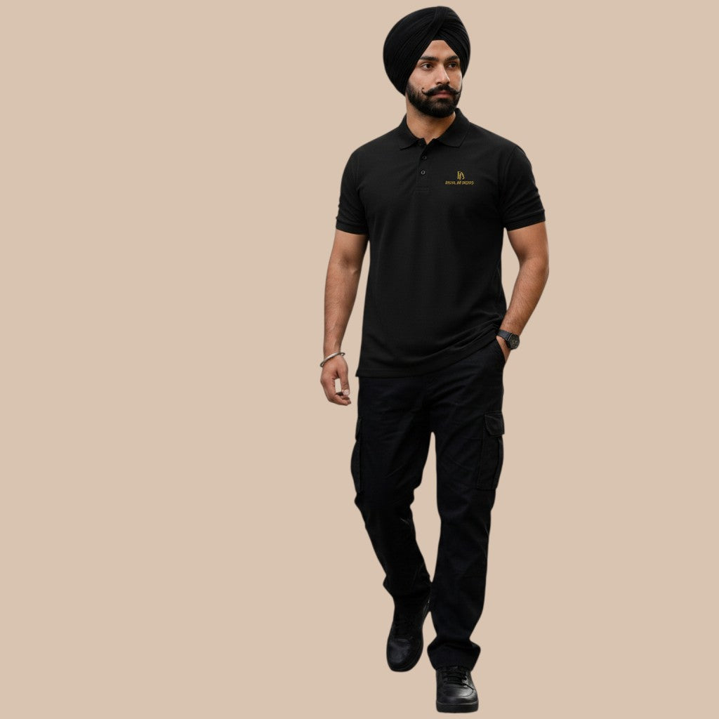 PUNJAB BOLDA black pique polo shirt with gold logo, 100% cotton, classic fit, ribbed collar, and tone-on-tone buttons.