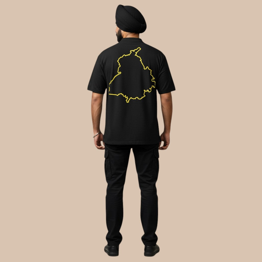 PUNJAB BOLDA black cotton t-shirt with yellow Punjab map outline on back. Model wears turban and cargo pants.