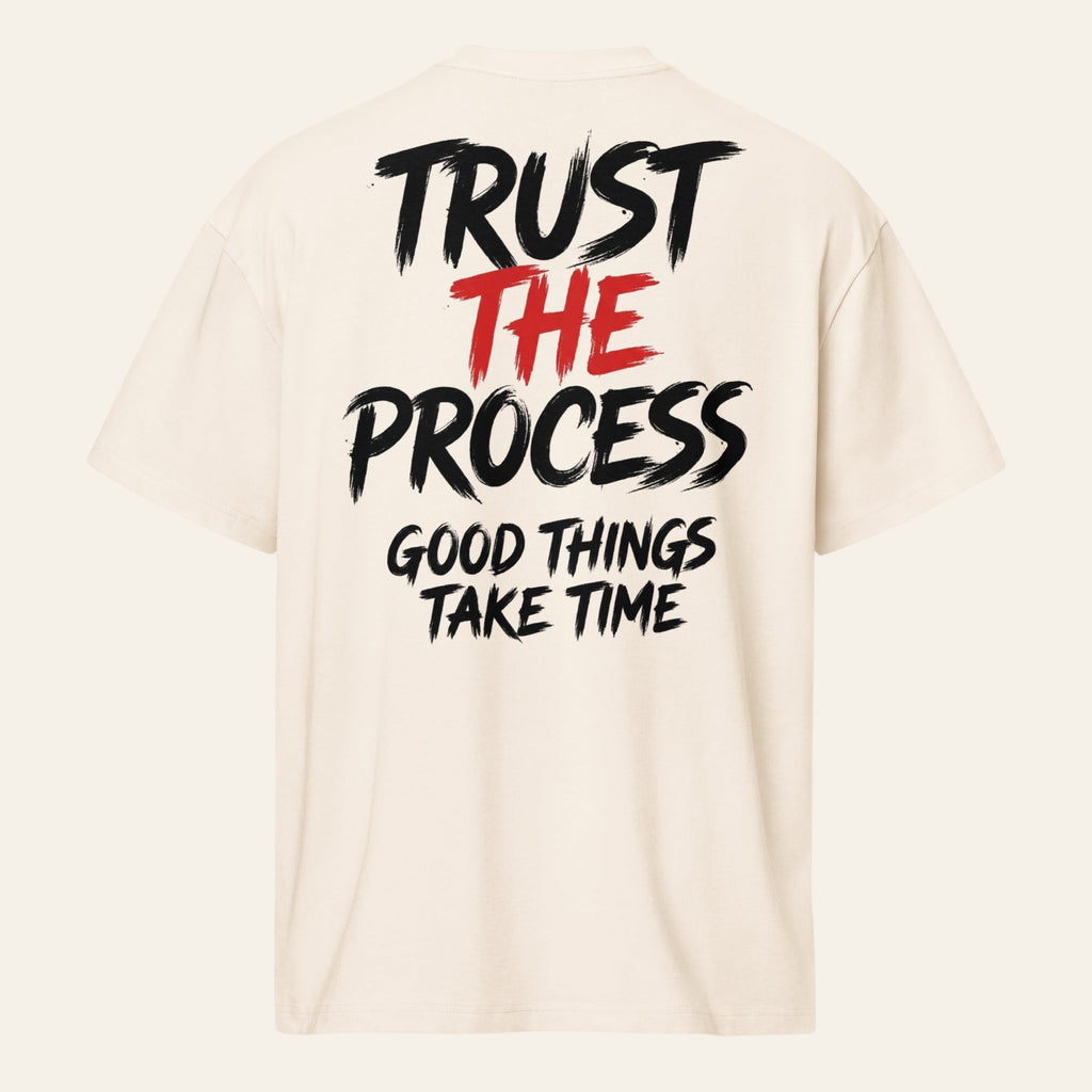 PUNJAB BOLDA cream oversized boxy tee with Trust The Process graphic print on the back in black and red text.