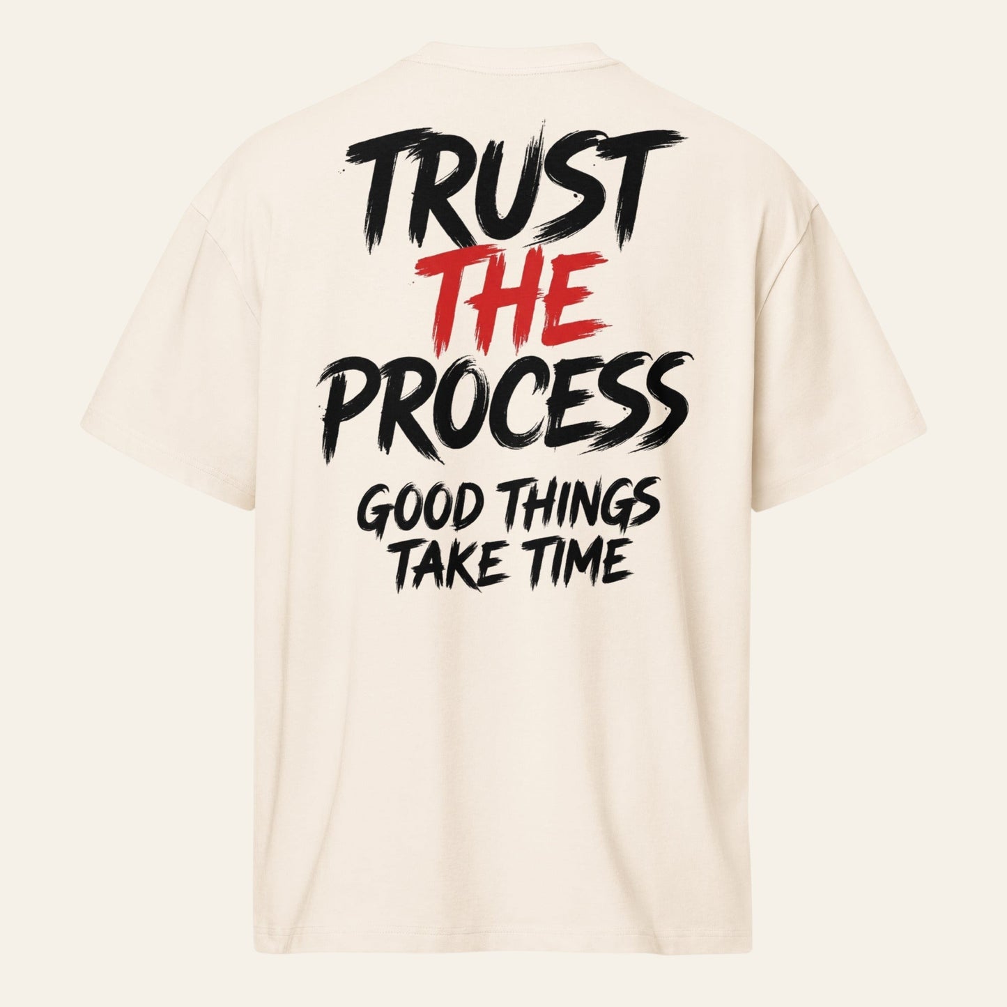 PUNJAB BOLDA cream oversized boxy tee with Trust The Process graphic print on the back in black and red text.