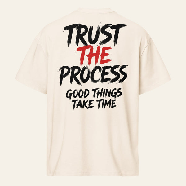 PUNJAB BOLDA cream oversized boxy tee with Trust The Process graphic print on the back in black and red text.