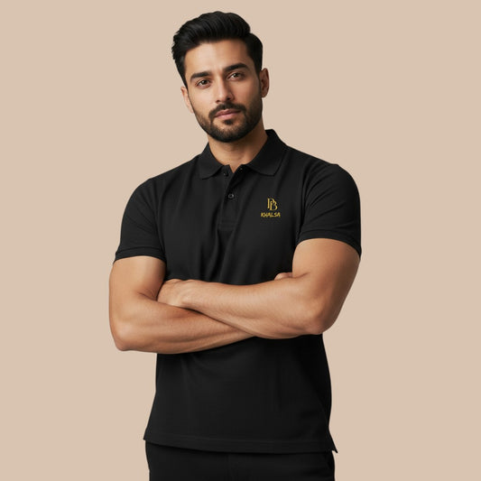 PUNJAB BOLDA KHALSA black pique polo shirt with gold logo, ribbed collar, and 3-button placket. 100% cotton.