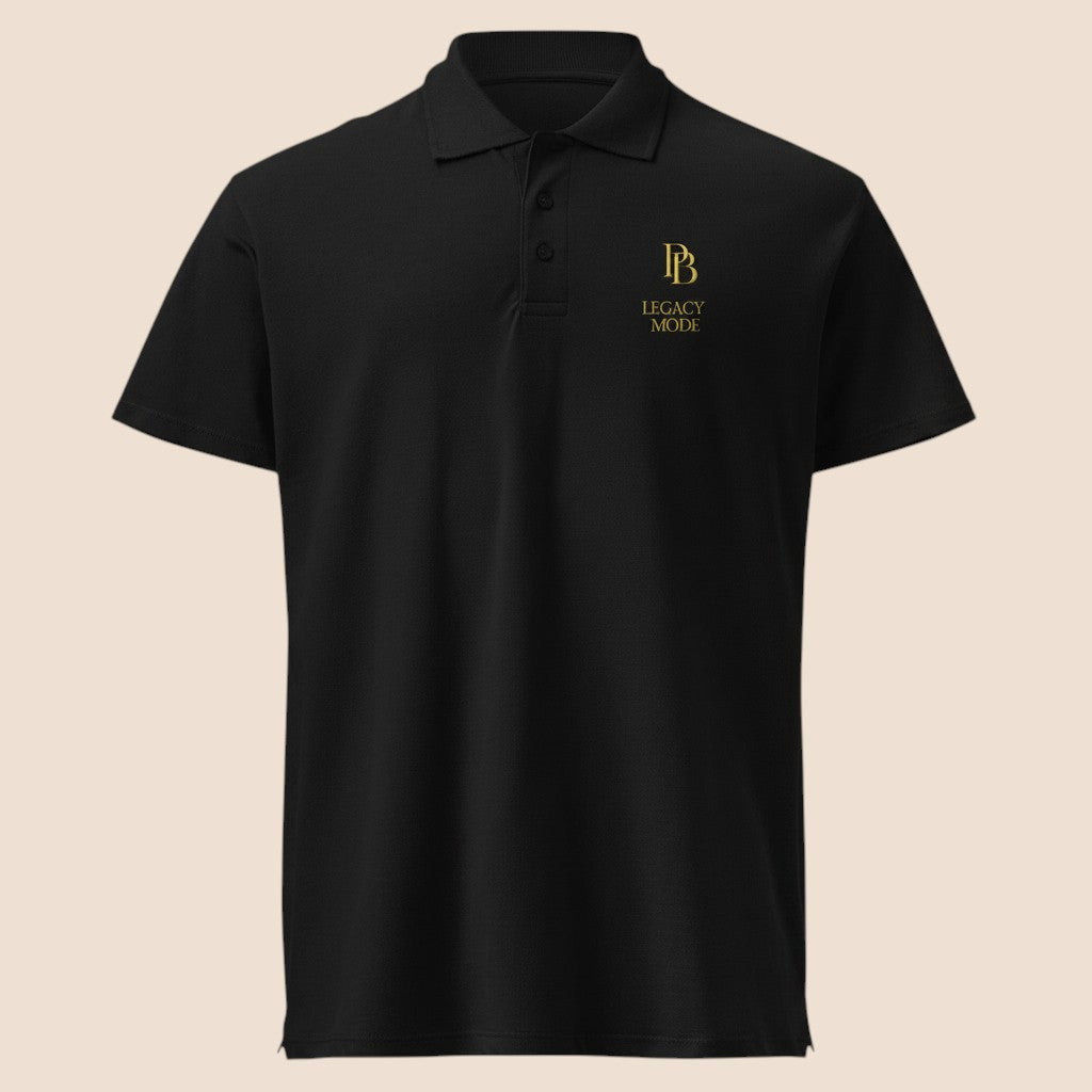 PUNJAB BOLDA black pique polo shirt with gold LEGACY MODE logo, featuring a 3-button placket and classic fit.