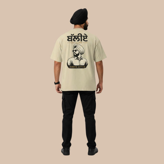 PUNJAB BOLDA beige oversized t-shirt with graphic print of a man wearing a turban and sunglasses.