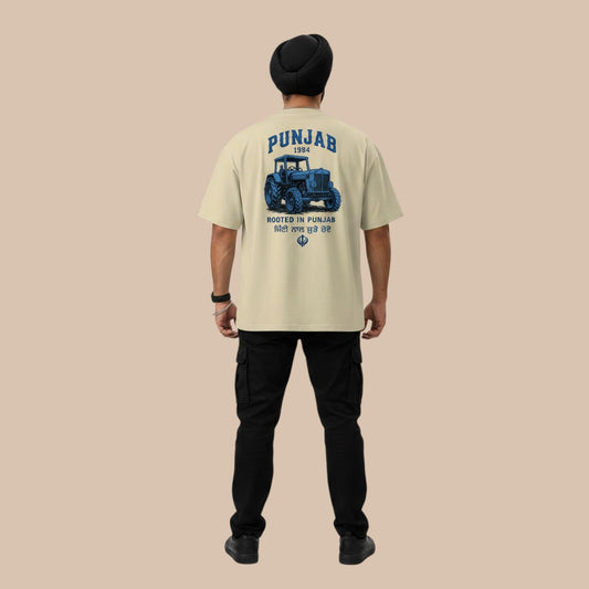 PUNJAB BOLDA oversized cream 100% organic cotton t-shirt with blue tractor graphic and text.