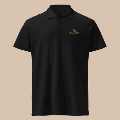 PUNJAB BOLDA ROYAL BY ROOTS black pique polo shirt with gold logo embroidery, 100% combed ring-spun cotton.